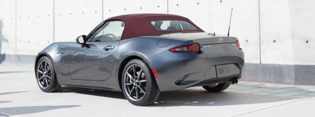 View of silver 2018 Mazda MX-5 Miata parked in a lighted area during the day