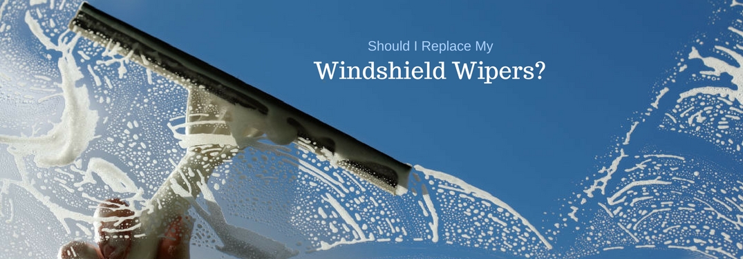 Should I Replace My Windshield Wipers, text on an image of a squeegee cleaning a windshield