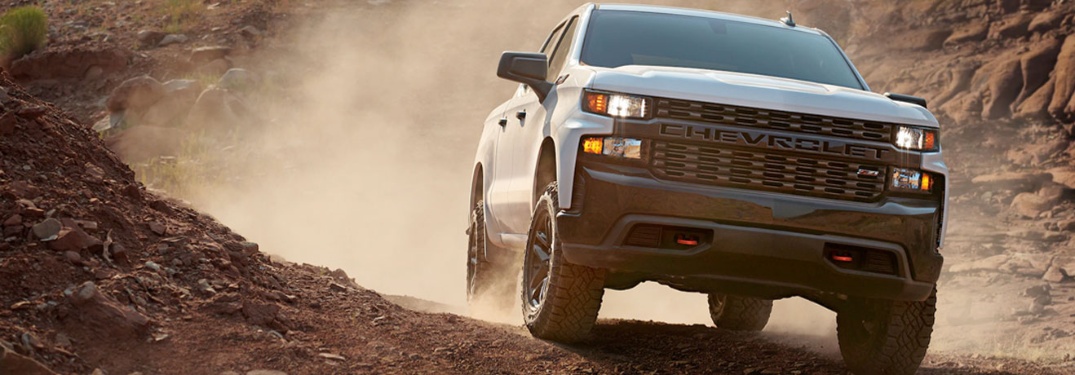 2020 Chevrolet Silverado cruising down the dirt road