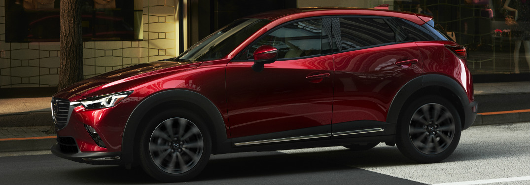 2019 Mazda CX-3 driving down street exterior driver side view