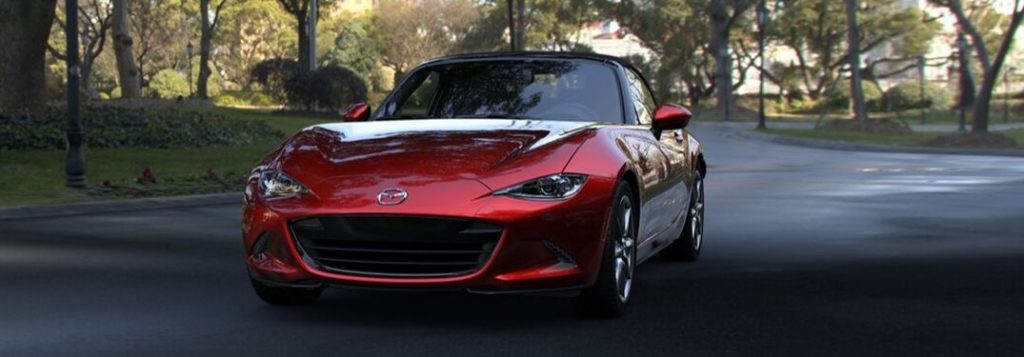2019 Mazda MX-5 Miata on road through wooded area