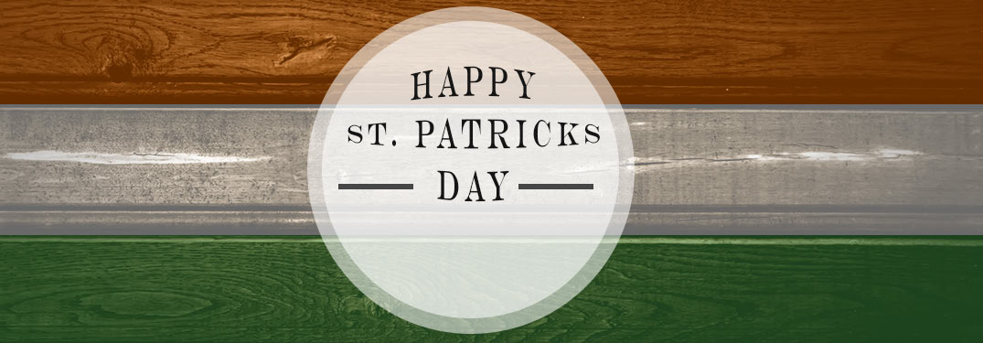 Green, White and Orange Wood Background with White Circle and Happy St. Patrick's Day Text