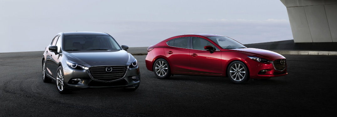 gray and red mazda3 hatchback cars