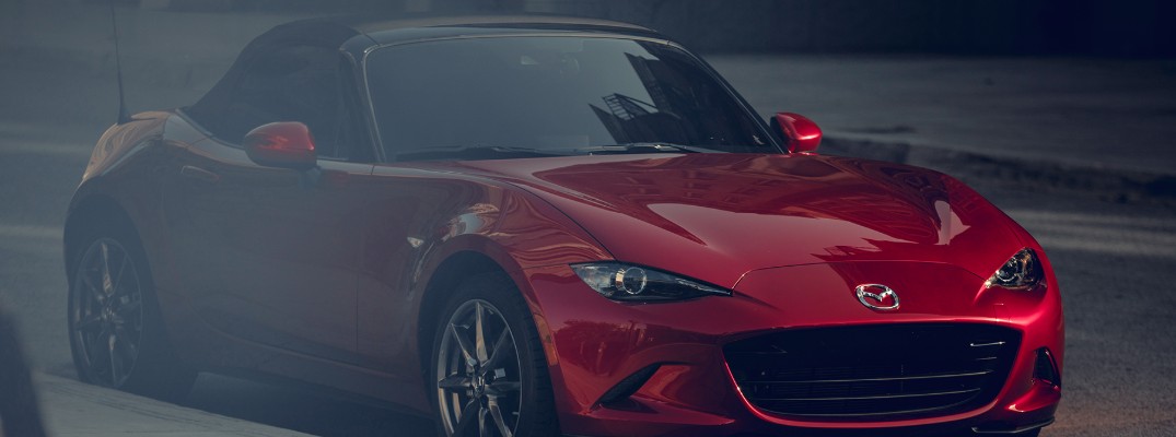 2019 Mazda MX-5 Miata exterior shot red paint driving to the right