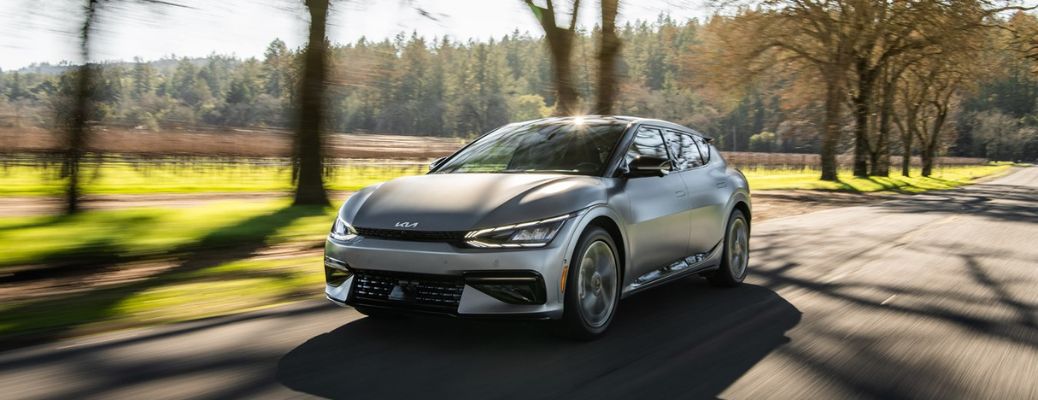 A 2022 Kia EV6 on a road abutting a farmland