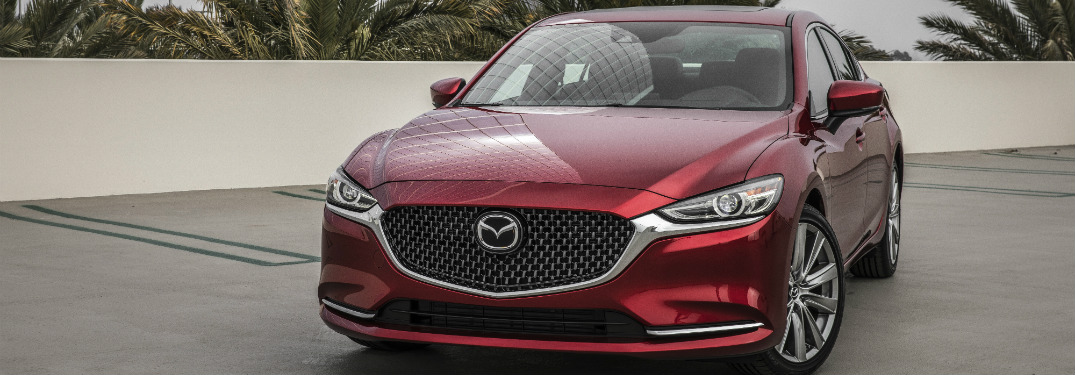 front view of red 2018 mazda6 on concrete driveway