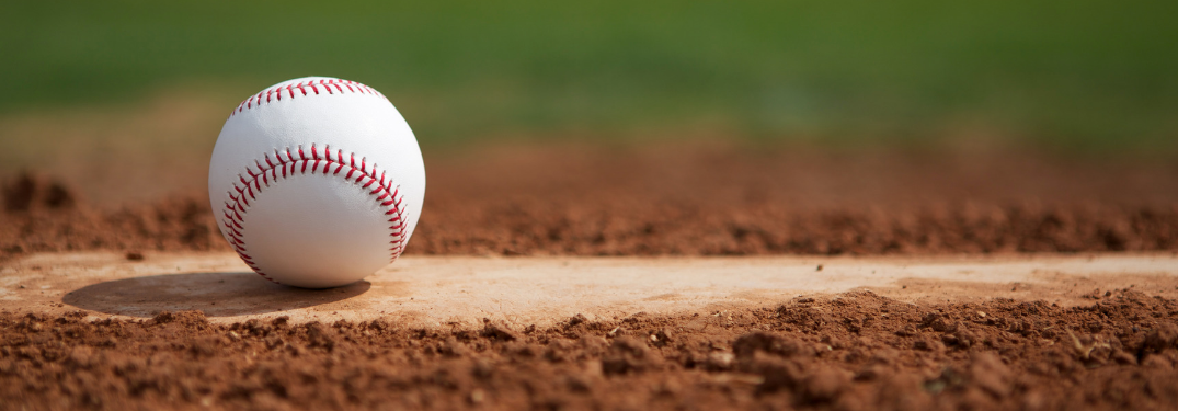 close-up of baseball on homeplate of diamond