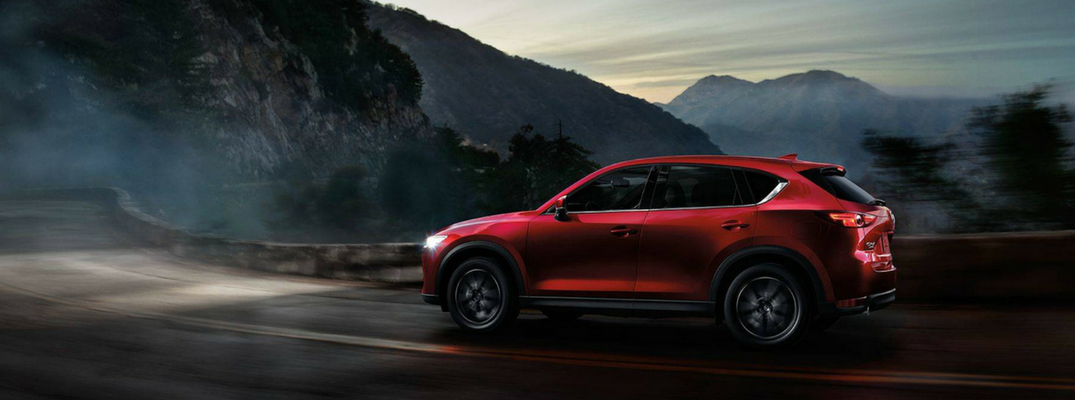 2018 Mazda CX-5 Side View of Red Exterior Driving near Mountains