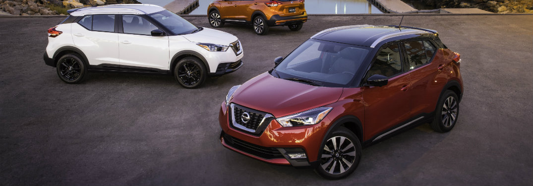 2018 Nissan Kicks in red in front of 2018 Nissan Kicks in white
