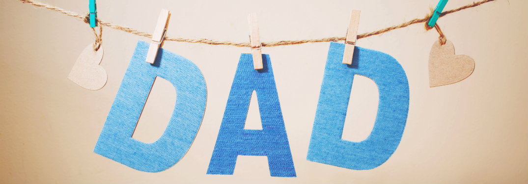 d-a-d letters hanging on string with clothespins