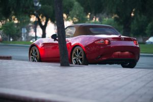 2019 Mazda MX-5 Miata exterior back fascia and drivers side parked on side of road with tree
