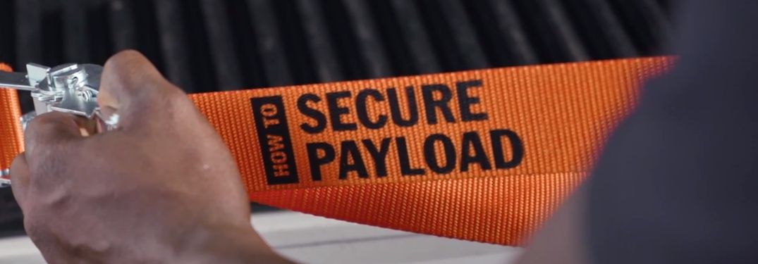 Truck Life ratchet strap with "How to Secure Payload" text