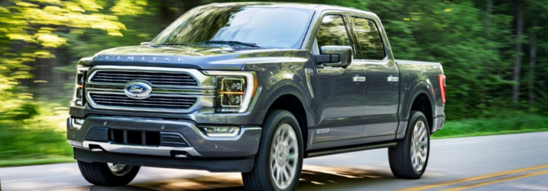 2021 Ford F-150 Hybrid on forest-lined road