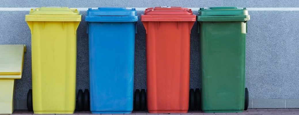 garbage recycling cans in different colors