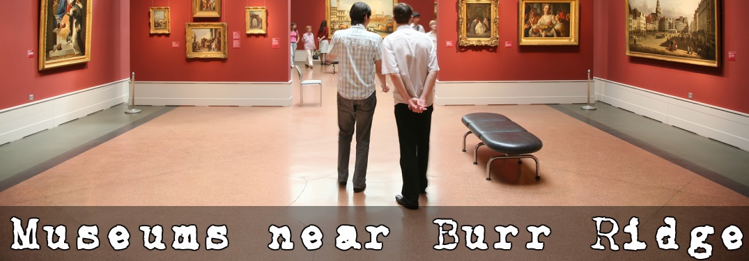 People walking through a museum with paintings on the wall