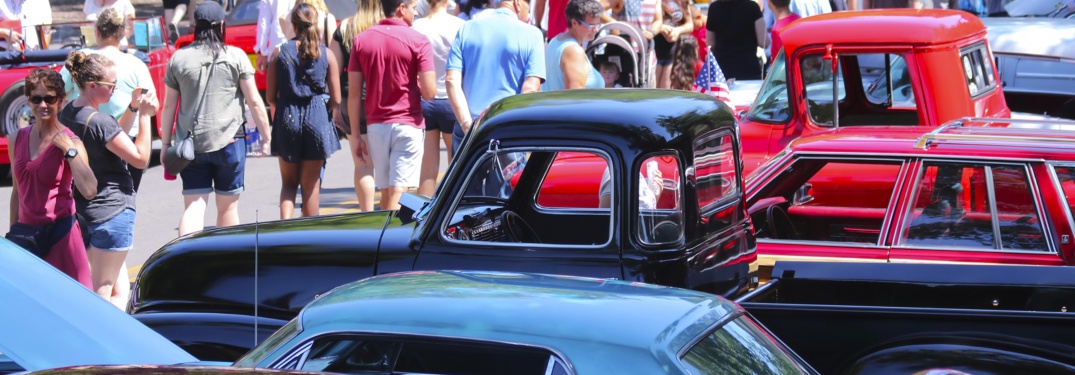 Car show with classic cars and trucks and a lot of people