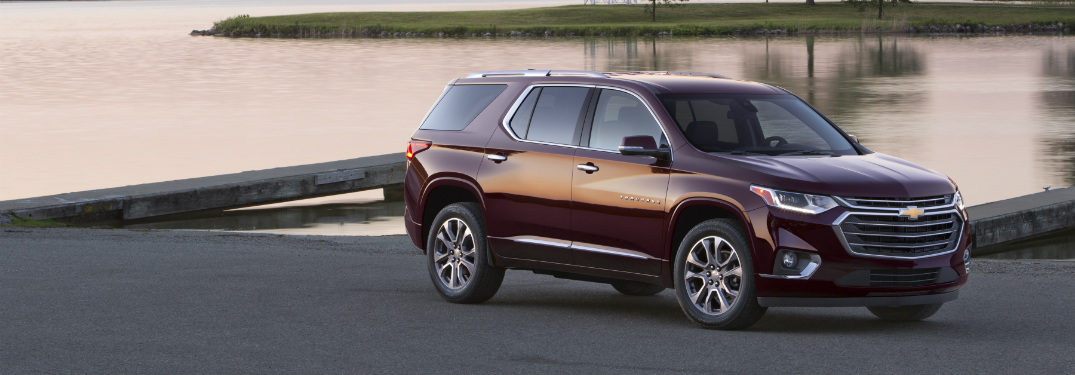 maroon 2018 chevy traverse parked near dock launch at sunset