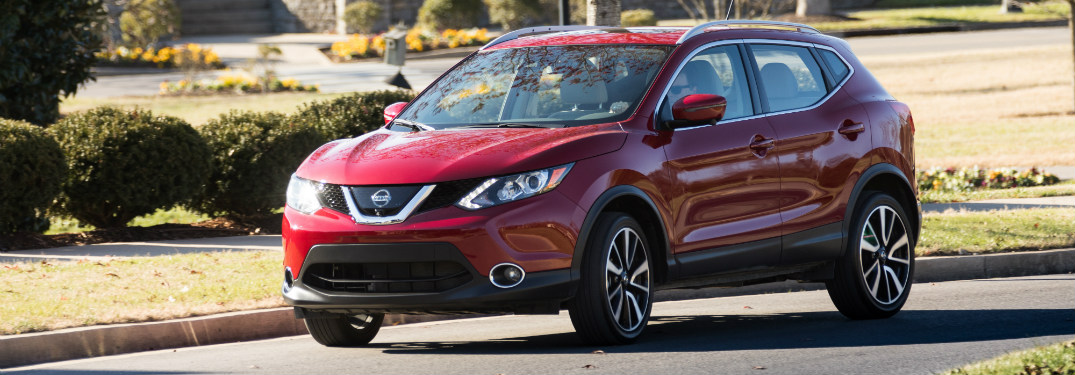 front and side view of red 2018 nissan rogue sport