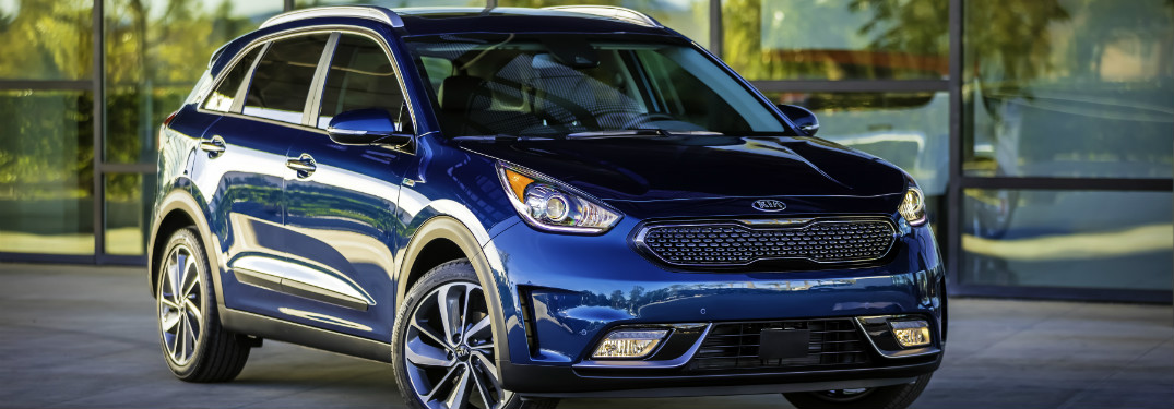 blue 2018 kia niro on display in driveway