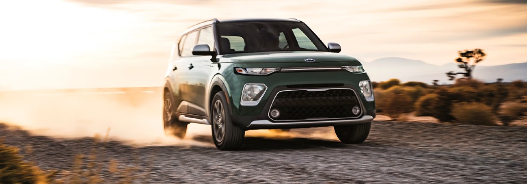 2020 Kia Soul green exterior front passenger side driving in joshua tree desert