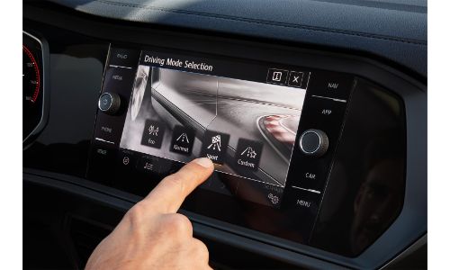 2020 Volkswagen Jetta interior showing hand touching info screen
