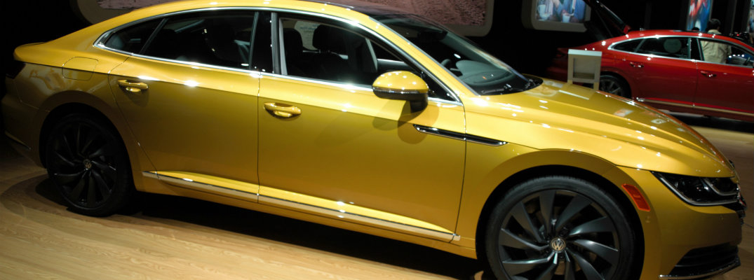 Side profile of gold-colored 2019 VW Arteon at CAS