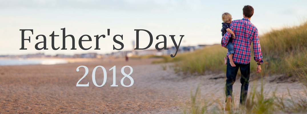 Father and Child Walking on a Beach with 'Father's Day 2018' text to the left