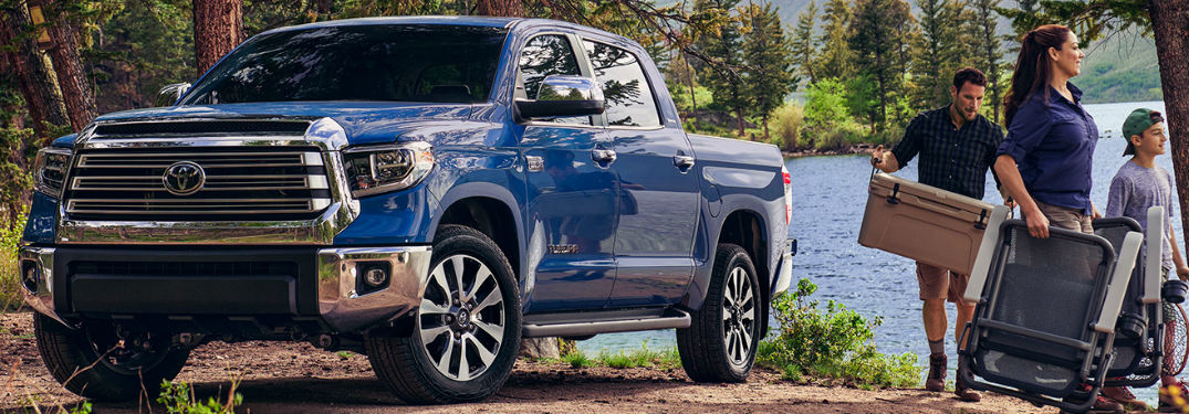 2020 Toyota Tundra with a family beside it