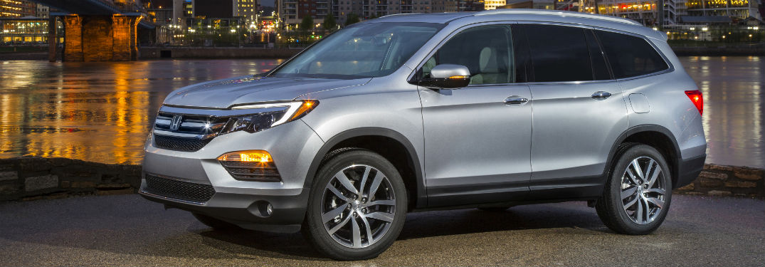 Driver side exterior view of a gray 2018 Honda Pilot