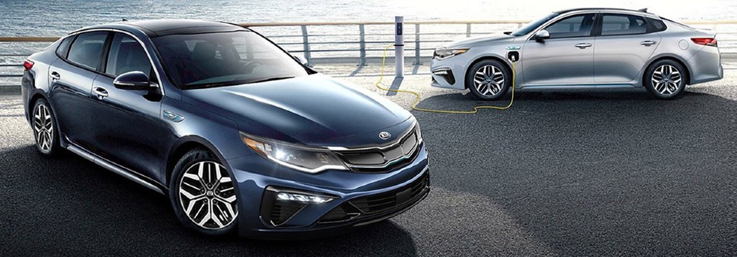 2020 kia optima parked next to another model