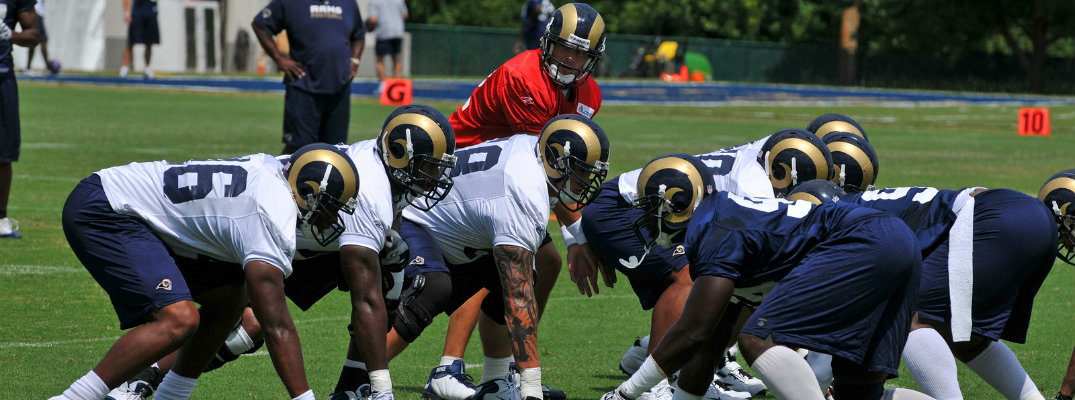 Offensive and defensive lines of Los Angeles Rams with quarterback under center