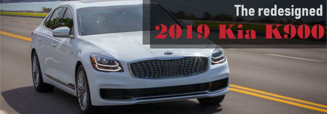 The Redesigned 2019 Kia K900 with image of a 2019 K900 driving down a highway with water and a city in the background