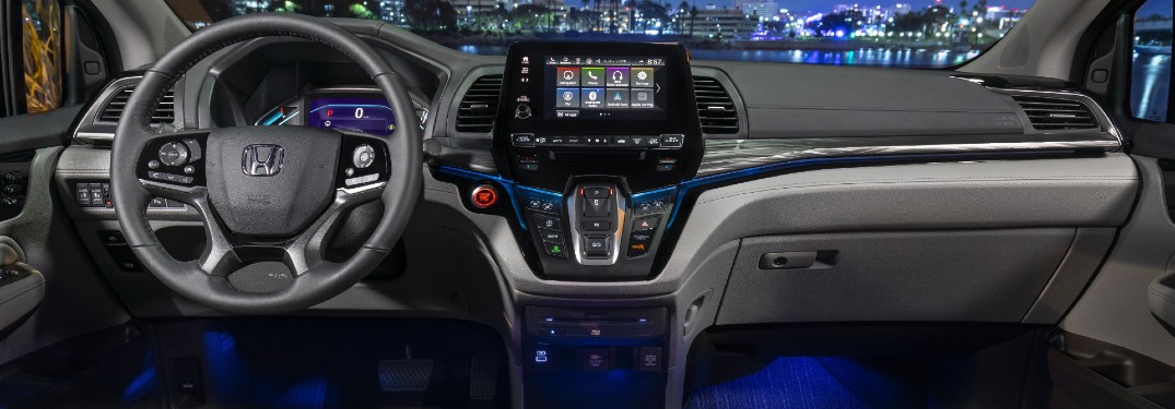2021 Honda Odyssey interior shot of steering wheel, transmission, infotainment screen, and dashboard layout