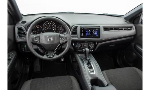 2021 Honda HR-V interior shot of front seating, steering wheel, and dashboard layout