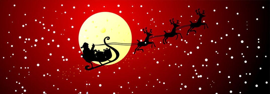 santa flying past the moon on a red night