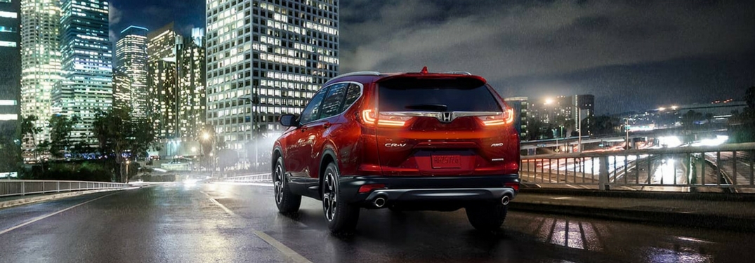 2018 Honda CR-V driving at night towards a city