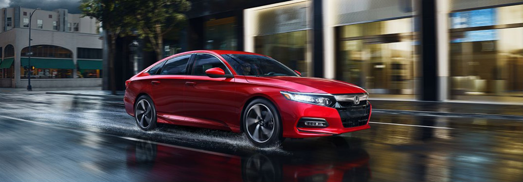 2018 Honda Accord driving down a wet road