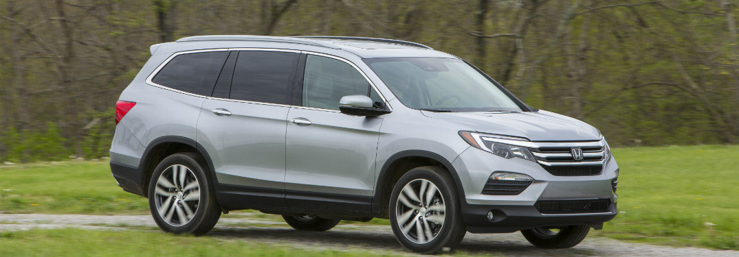2018 Honda Pilot driving down a trail