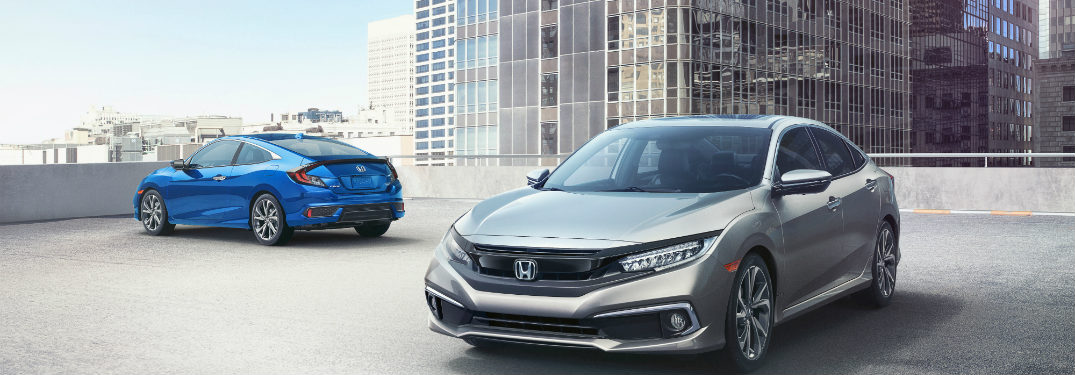 Two 2019 Honda Civic models in a parking complex