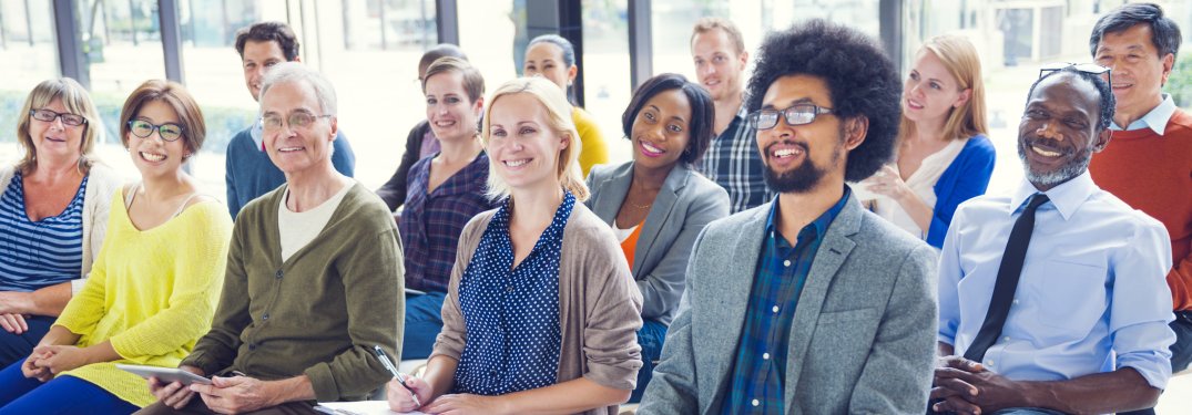 A group of people sitting down for a seminar