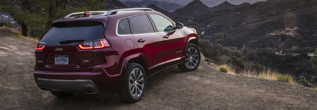 Rear exterior view of a red 2019 Jeep Cherokee