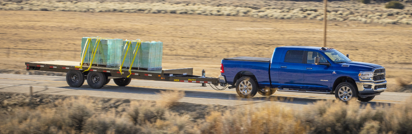 Blue 2020 Ram 2500 towing a trailer