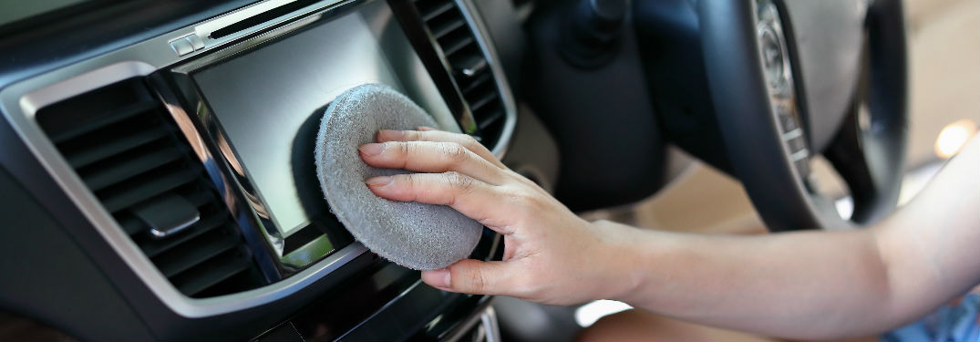 Woman cleaning sound system