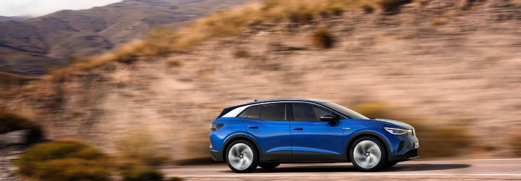 side view of the 2021 VW ID.4 driving by cliff