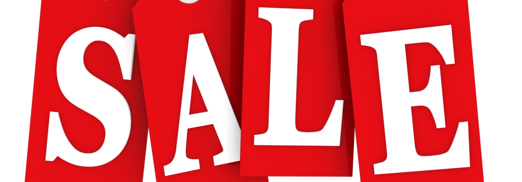 red sale tags on white
