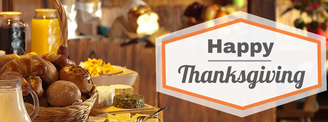 Happy Thanksgiving banner with delicious Thanksgiving food in the background