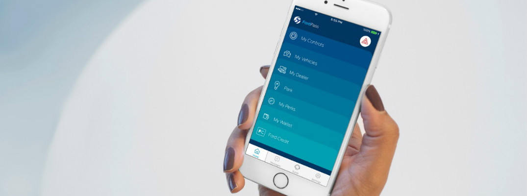Hand holding an iPhone with the FordPass app pulled up