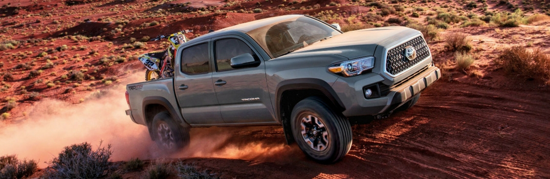 2018 Toyota Tacoma driving on dirt.