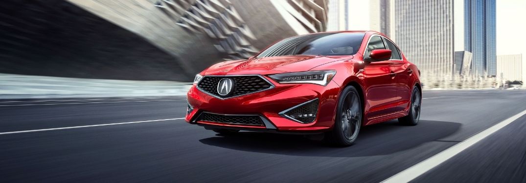 Red 2021 Acura ILX on a City Freeway