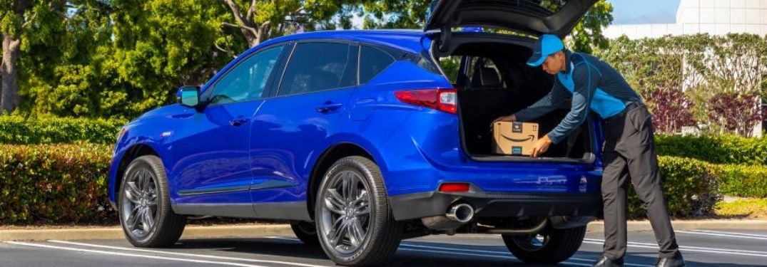Man Loading Cargo in Back of 2021 Acura RDX